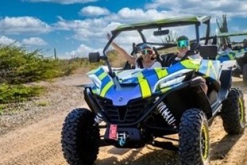 a truck driving down a dirt road