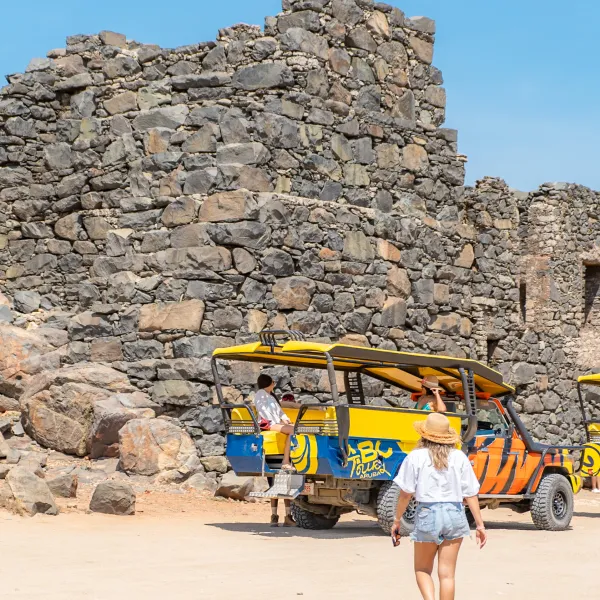 a person sitting on a rock