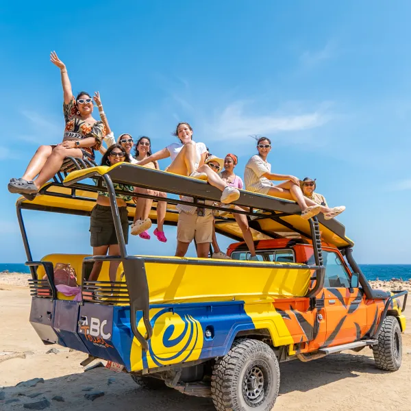 a person driving a boat on the beach
