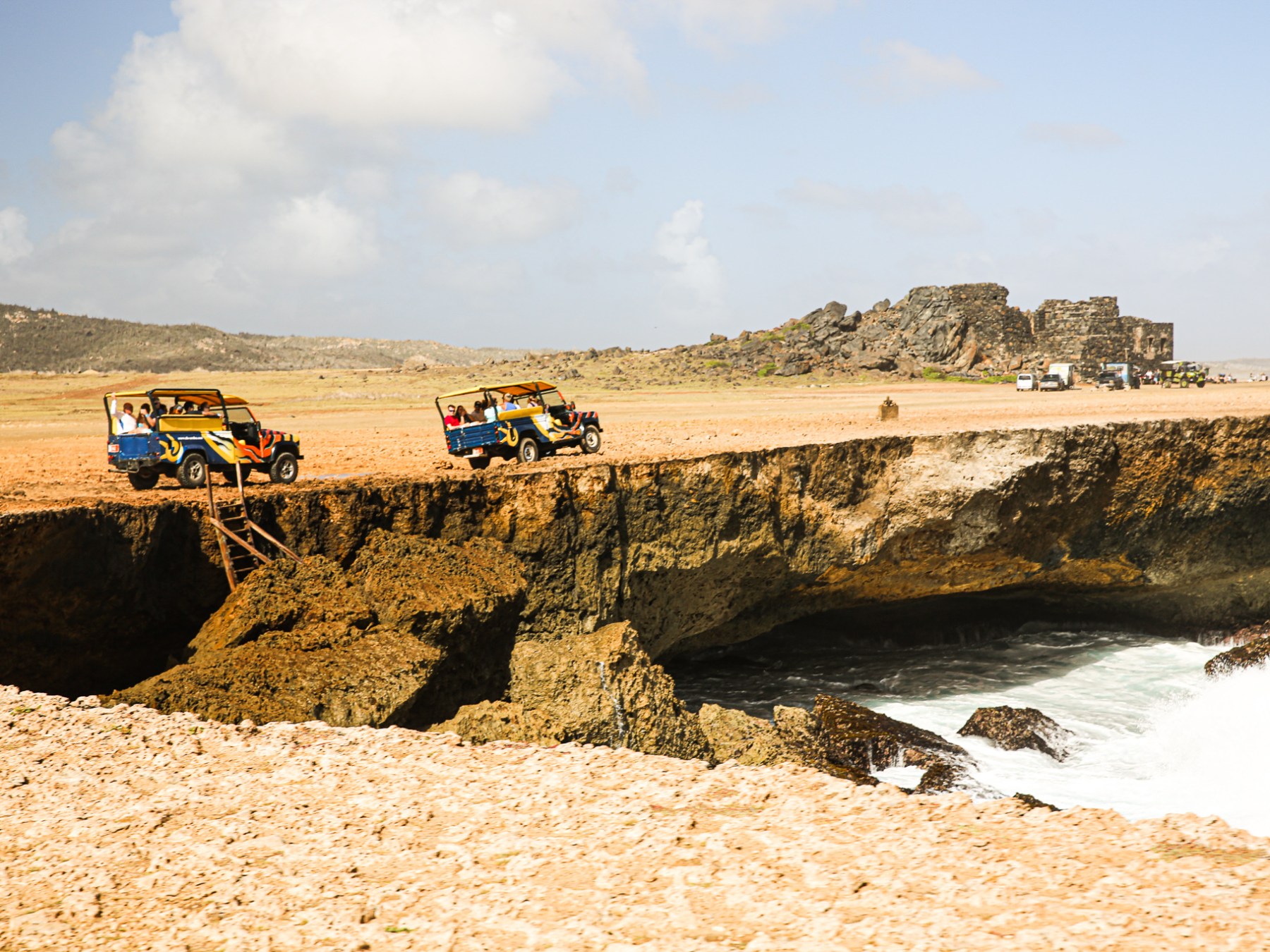 a group of people on a rocky beach