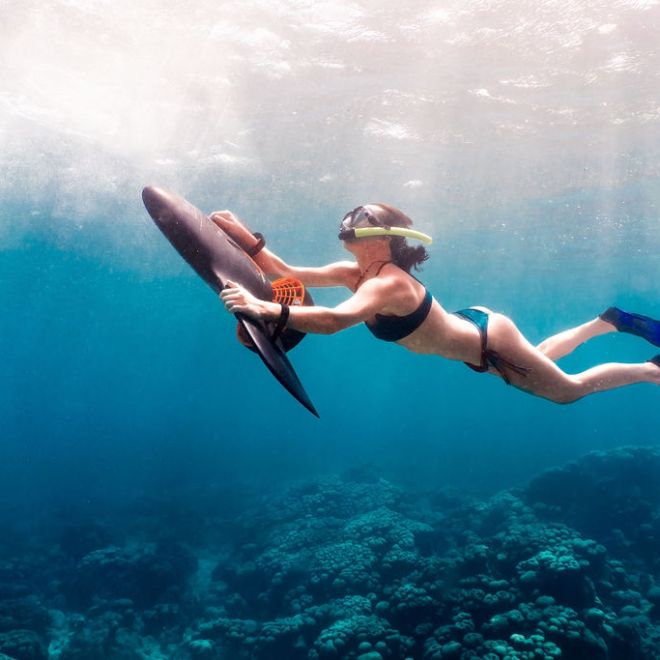 a person riding a wave on top of a body of water