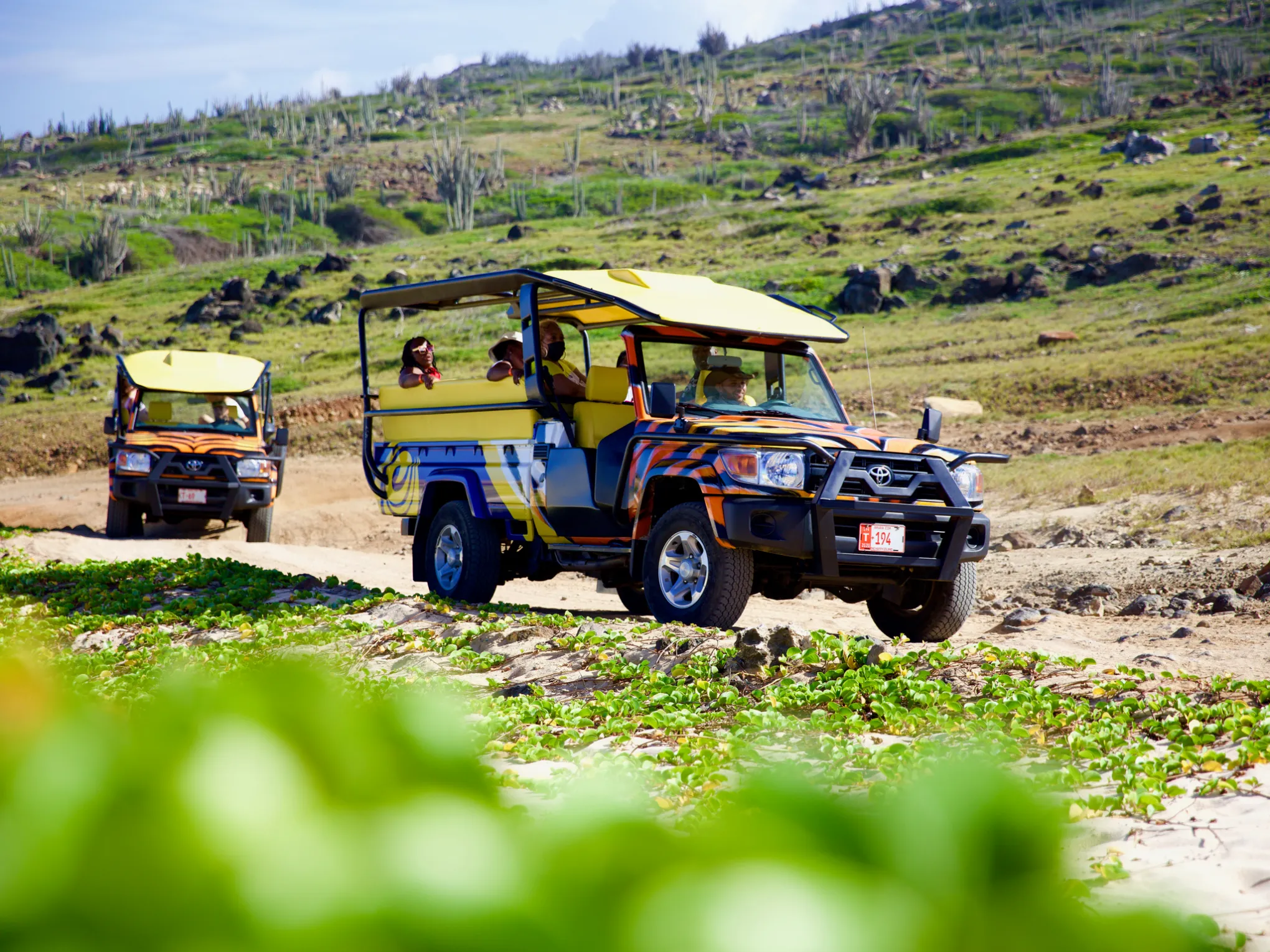 a truck driving down a dirt road