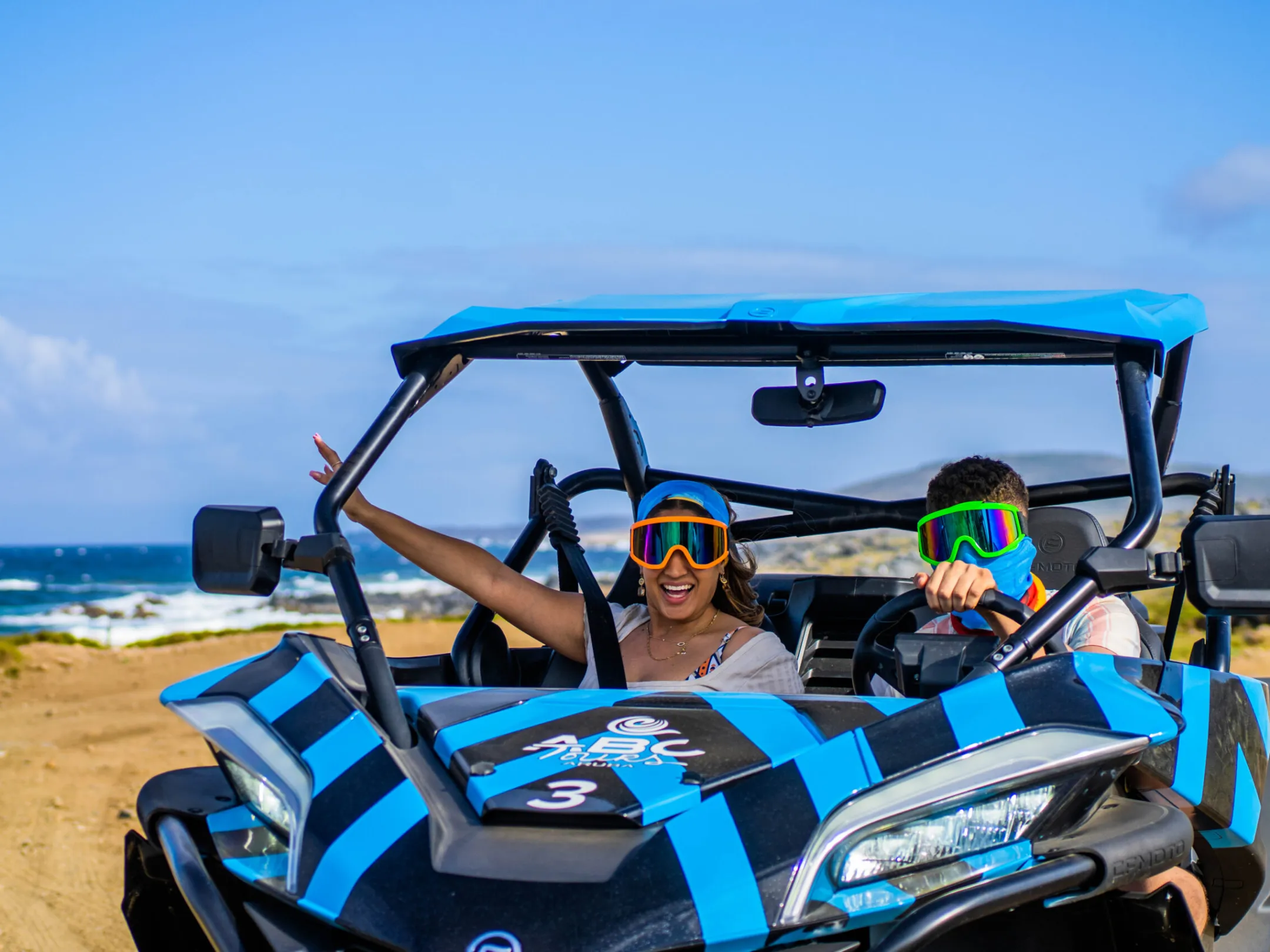 a group of people sitting at a beach