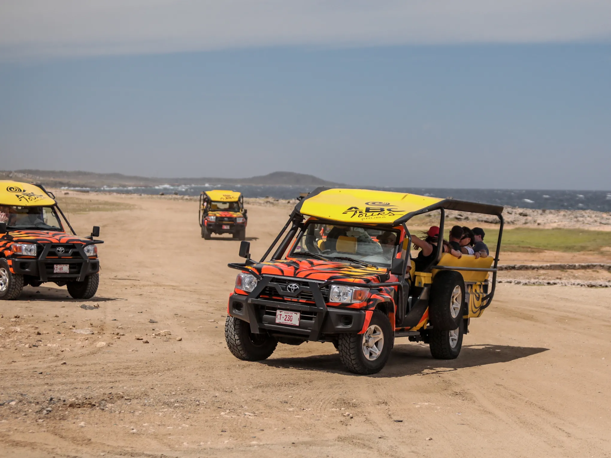 a car driving on a sandy beach