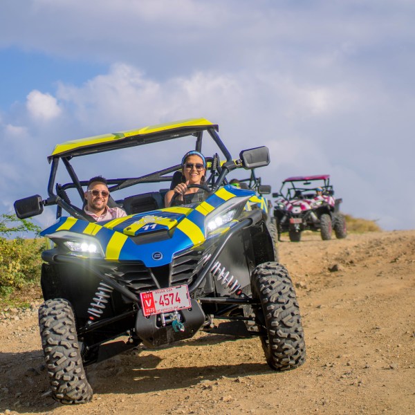 a truck driving down a dirt road