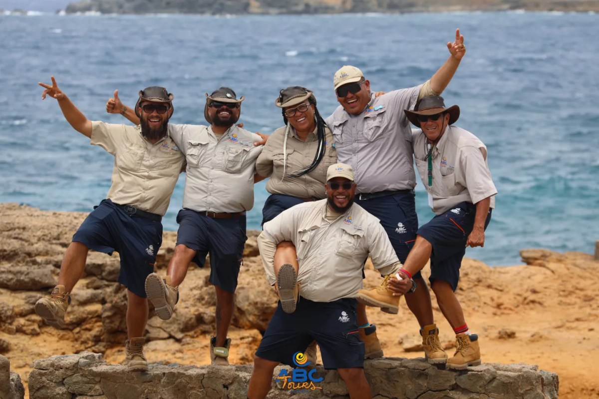 Group-page-photo-2- a group of people on a rocky beach